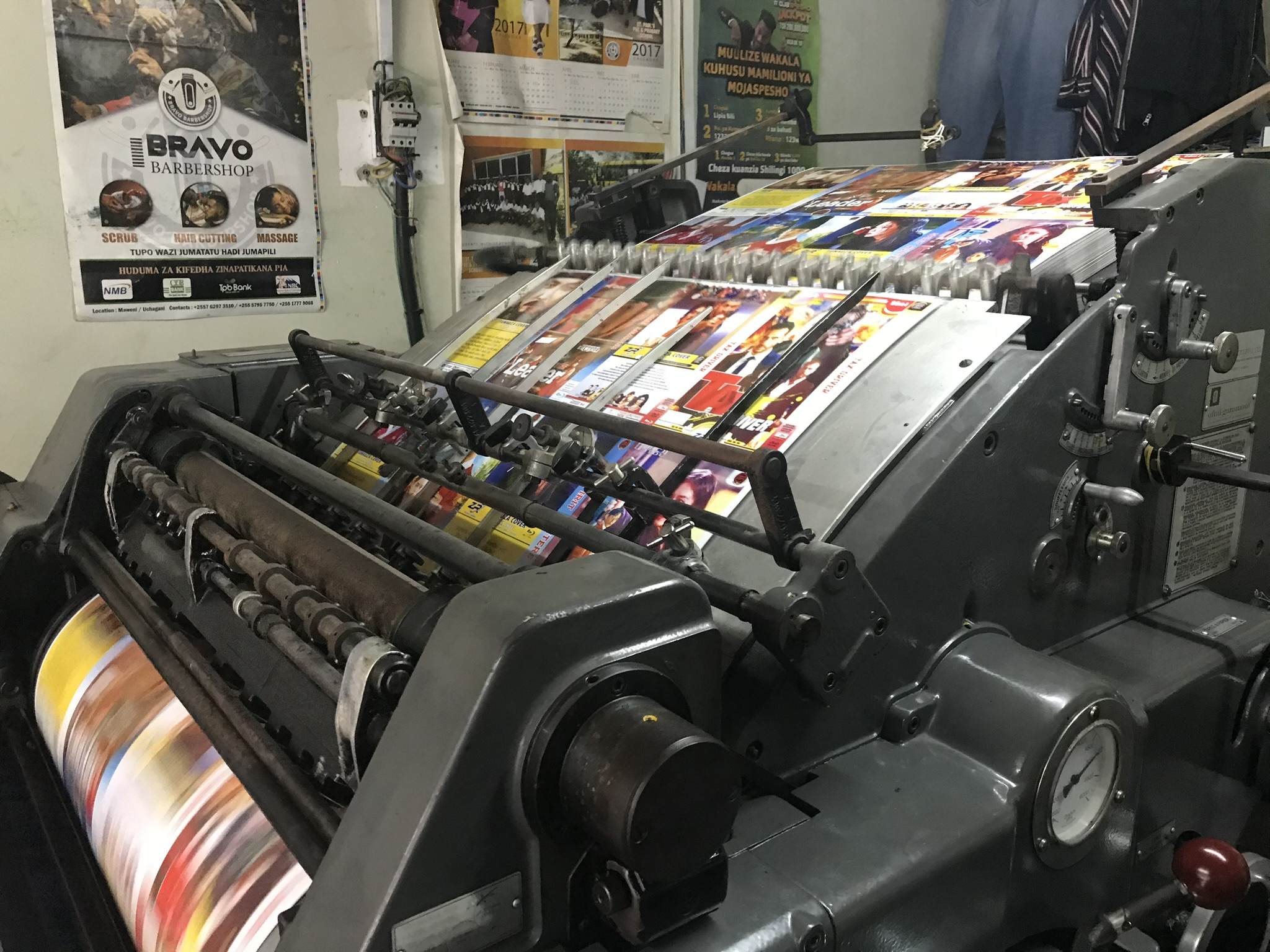 Commercial offset press producing full-colour print